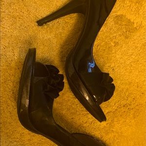 Black patent leather stilettos.